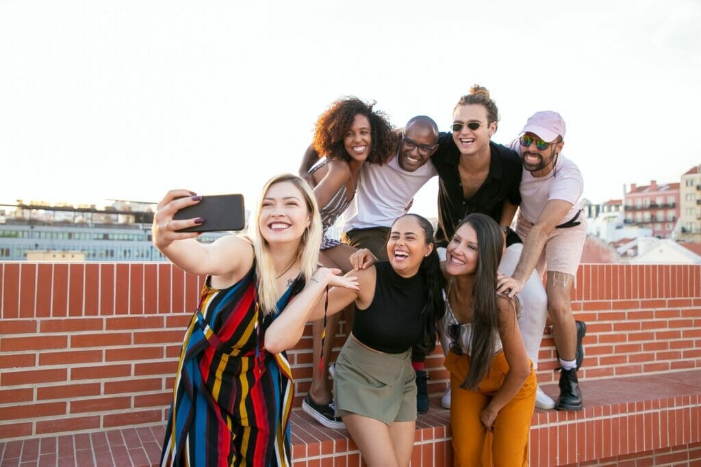 A group of 2 boys and 5 women status on a house roof, shooting completely happy moments with smiles and laughter as they take photos for the duration of a bachelorette celebration celebration. Bachelorette celebration captions and prices for sister
